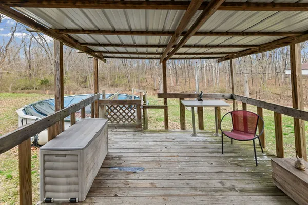 a view of a balcony with furniture