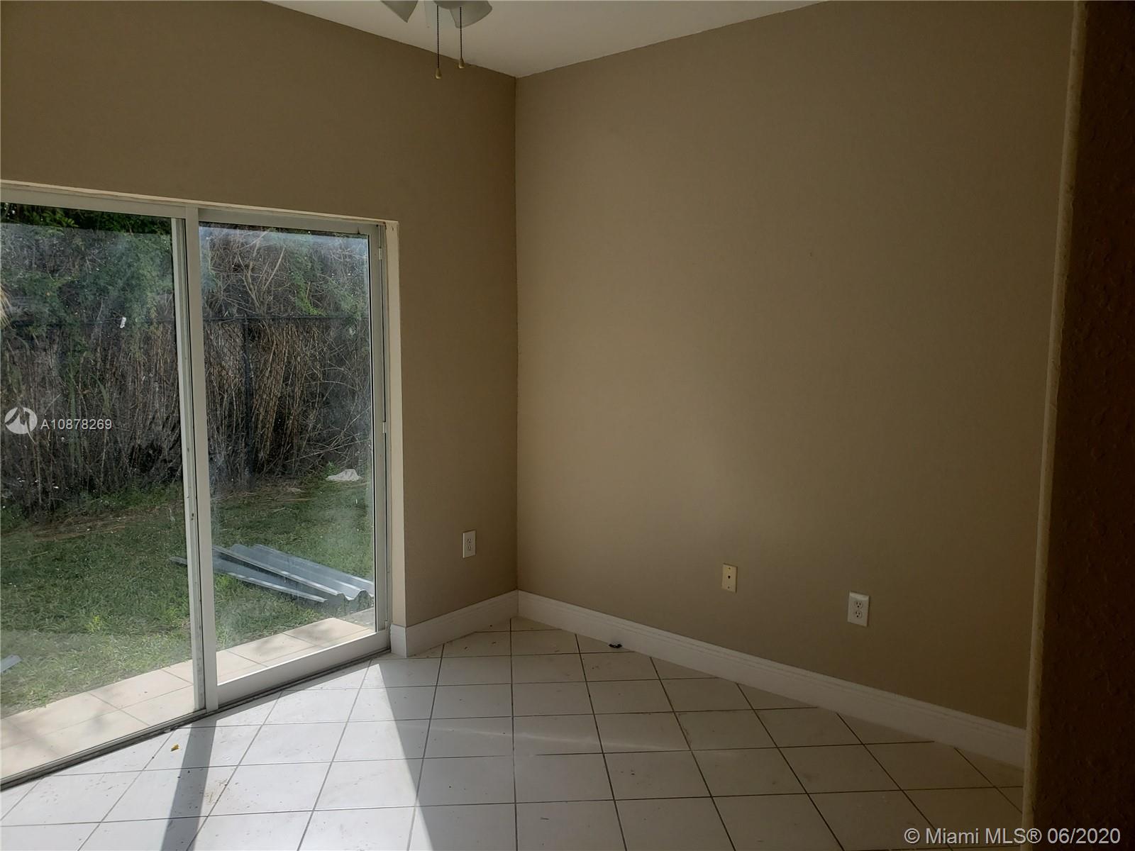 2551 Southeast 16th Terrace, Unit 104 Homestead, FL 33035 - Photo 2 of 7 a view of an empty room