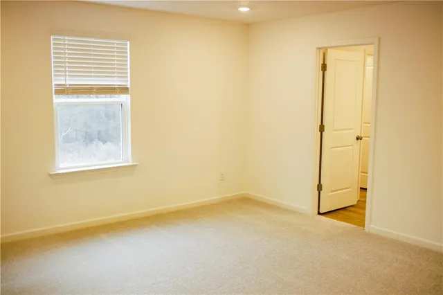 a bathroom with a tub sink and a mirror