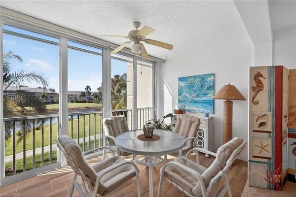 a view of a dining room with furniture window and outside view