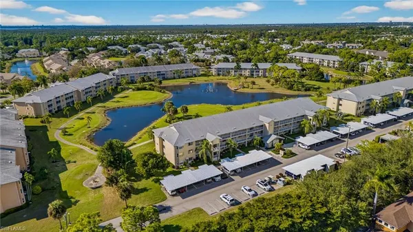 an aerial view of a house with a swimming pool yard and outdoor seating