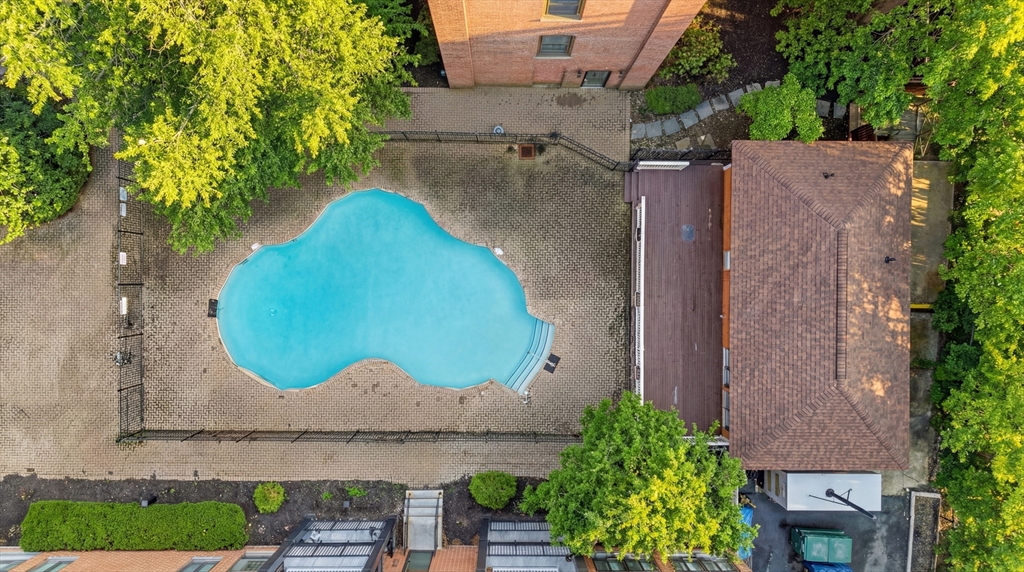 50 Rantoul Street, Unit 204 Beverly, MA 01915 - Photo 40 of 41 an aerial view of a house with garden space and a swimming pool