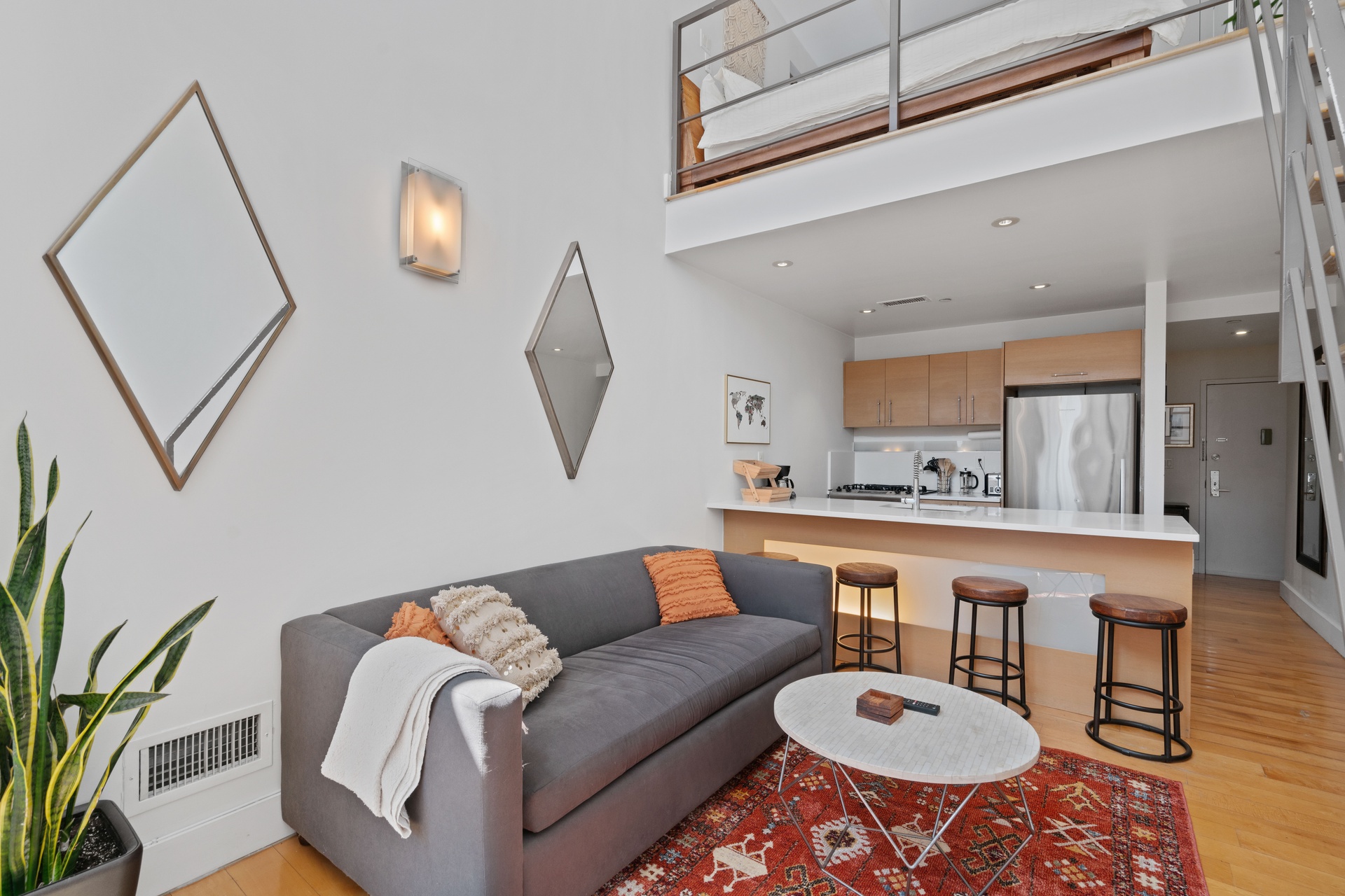 96 Woodpoint Road, Unit 2C Brooklyn, NY 11211 - Photo 5 of 9 a living room with furniture a rug and white walls