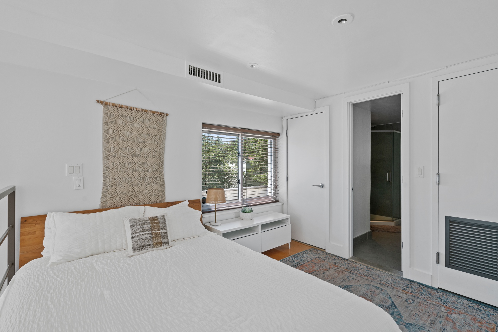 96 Woodpoint Road, Unit 2C Brooklyn, NY 11211 - Photo 7 of 9 a bedroom with a bed and a large window