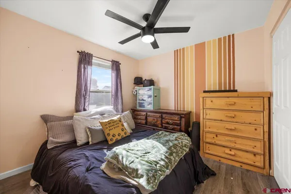 a bed room with a bed and a window