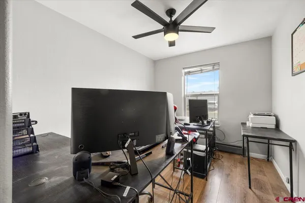 a view of a livingroom with furniture and a flat screen tv