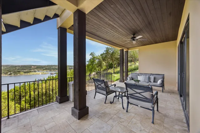 a balcony with furniture and city view