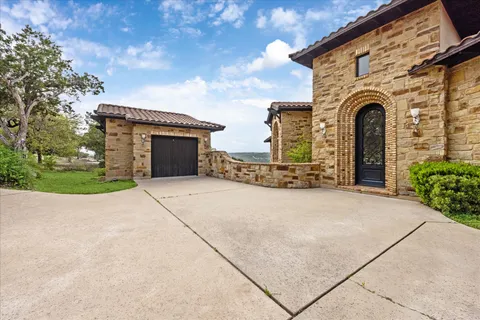 a front view of a house with yard