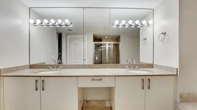 a kitchen with stainless steel appliances granite countertop a stove and a refrigerator