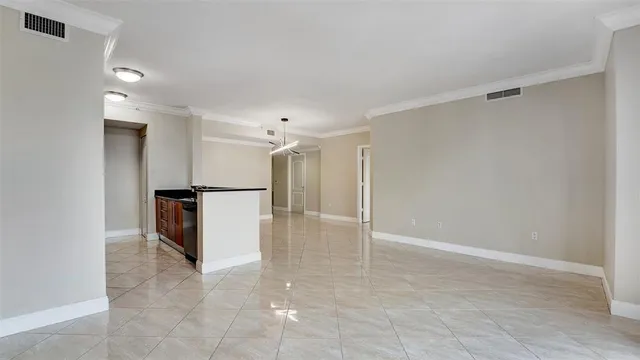 a utility room with closet and mirror