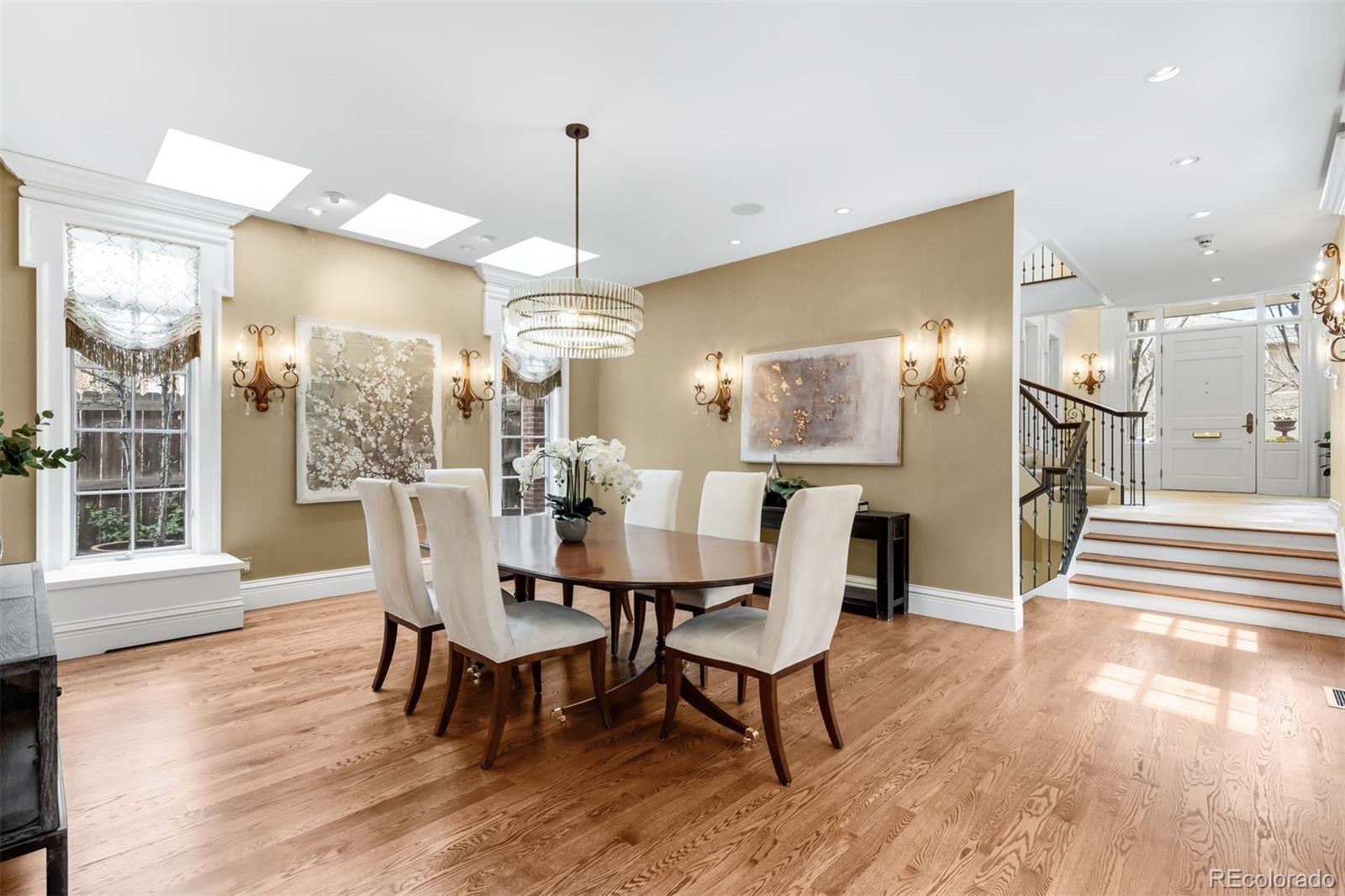 465 Monroe Street Denver, CO 80206 - Photo 12 of 47 a view of a dining room with furniture window and wooden floor