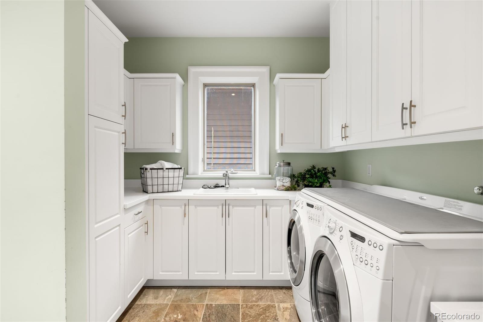 465 Monroe Street Denver, CO 80206 - Photo 22 of 47 a utility room with dryer and washer