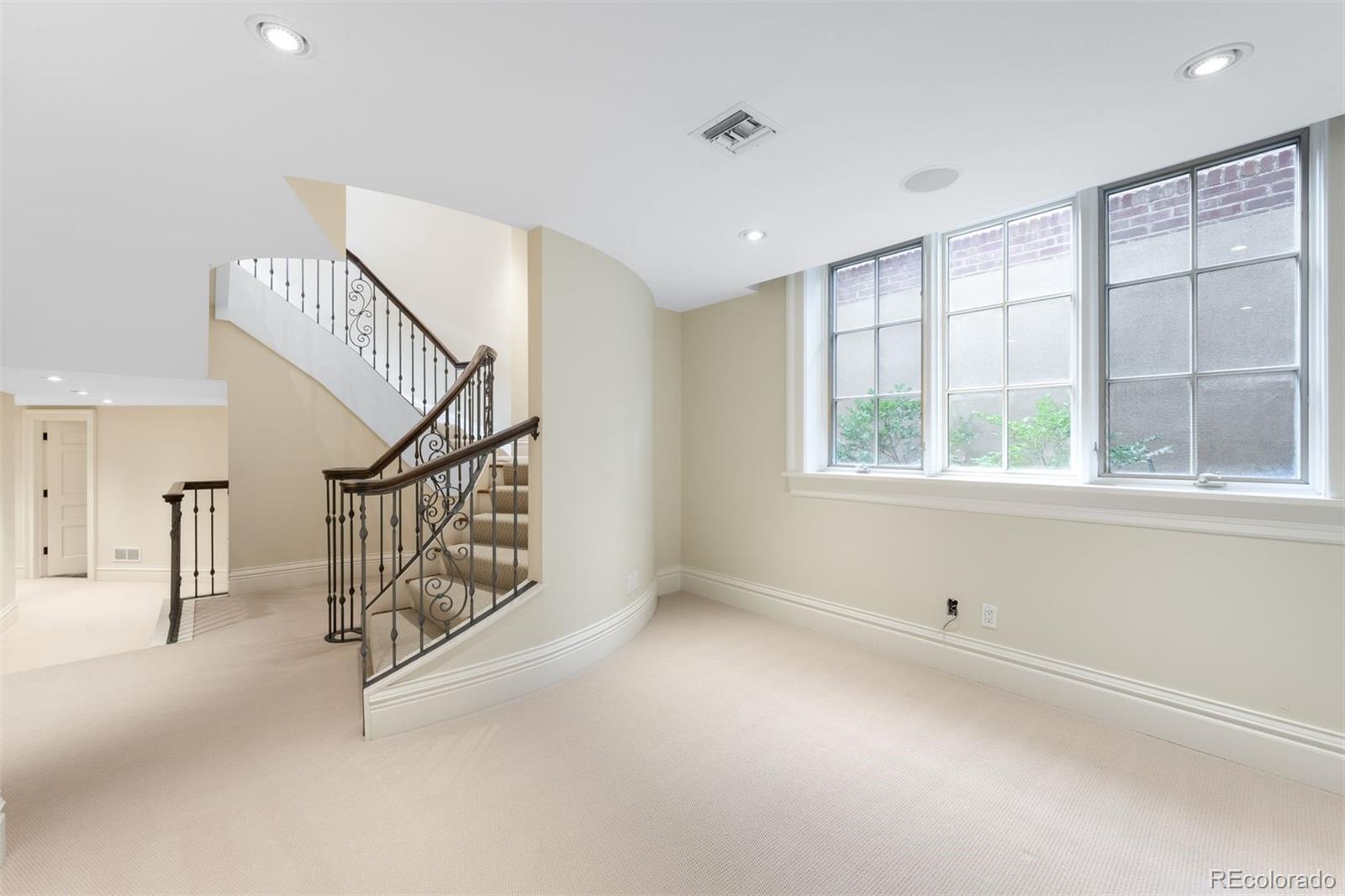 465 Monroe Street Denver, CO 80206 - Photo 36 of 47 a view of entryway and hall with a window