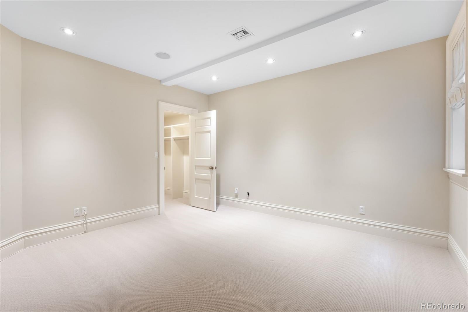 465 Monroe Street Denver, CO 80206 - Photo 38 of 47 an empty room with closet and windows