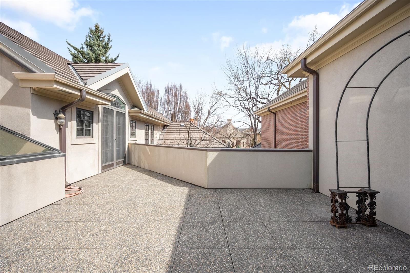 465 Monroe Street Denver, CO 80206 - Photo 42 of 47 a view of a building with a bench