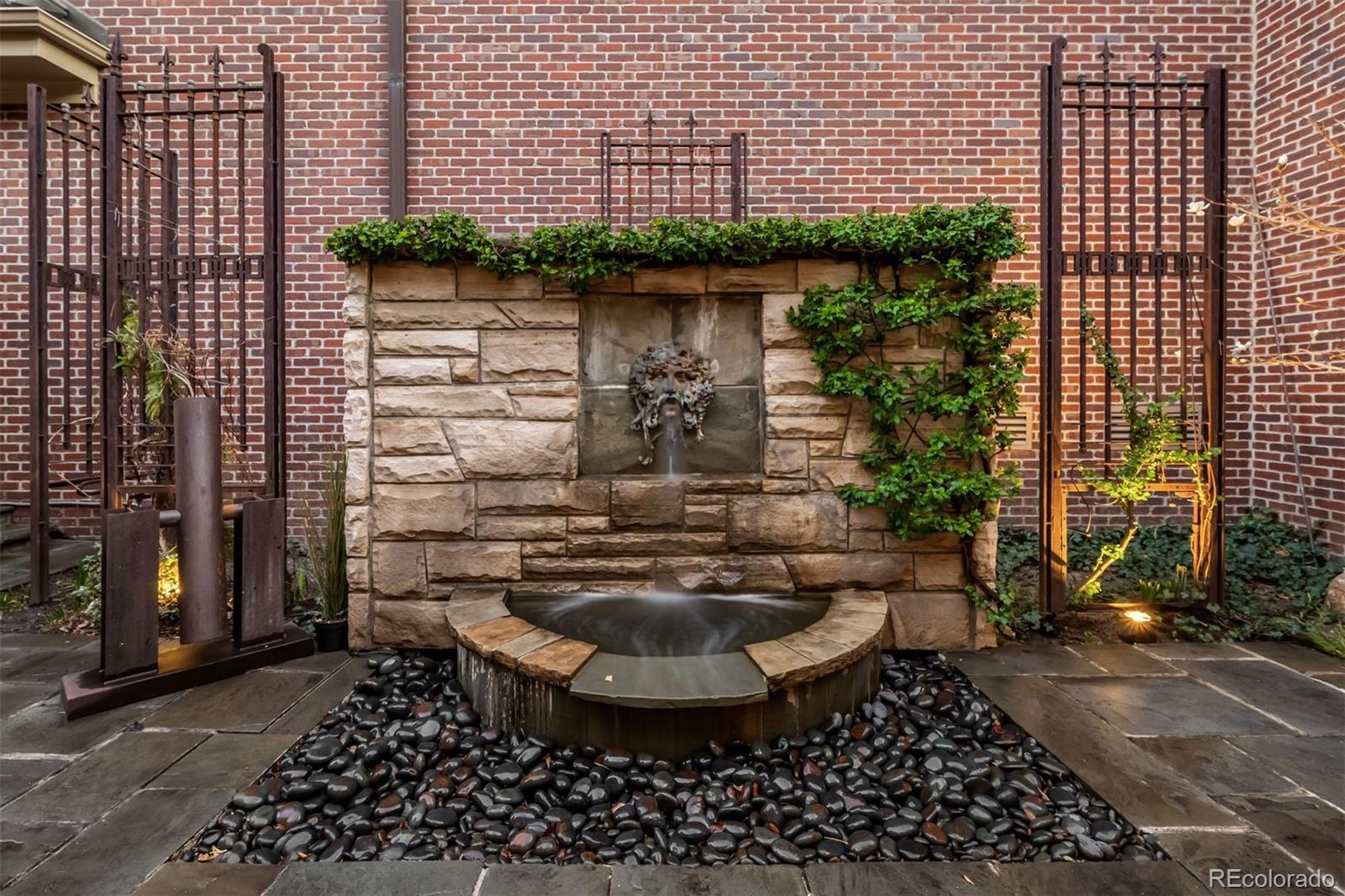 465 Monroe Street Denver, CO 80206 - Photo 7 of 47 a view of a water fountain in front of a building