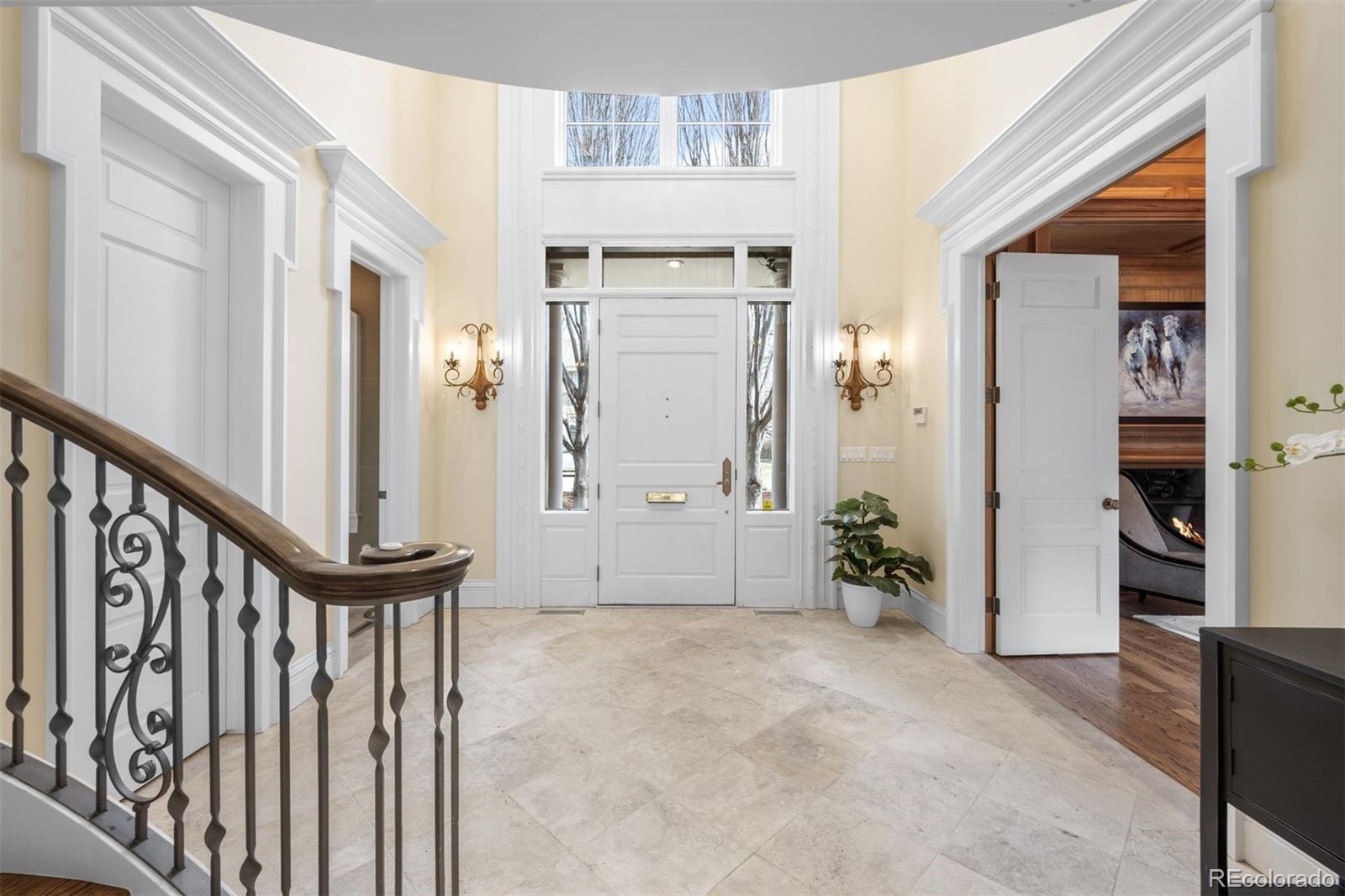 465 Monroe Street Denver, CO 80206 - Photo 9 of 47 a view of a hallway with entryway and stairs