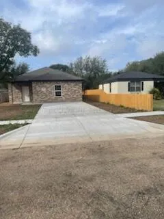 a view of swimming pool with outdoor seating and yard in back