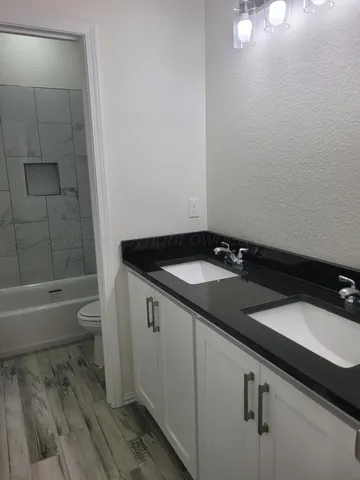 a bathroom with a sink and a bathtub