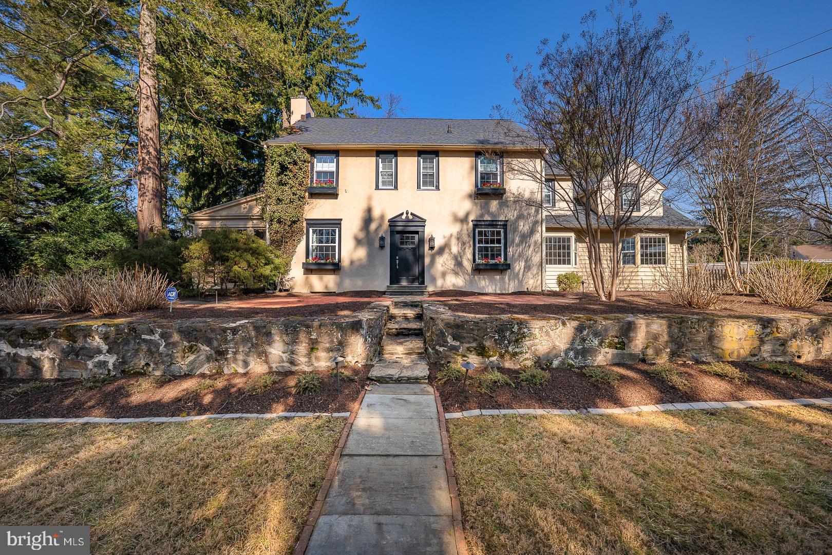 108 South Spring Mill Road Villanova, PA 19085 - Photo 2 of 53 a front view of a house with a yard
