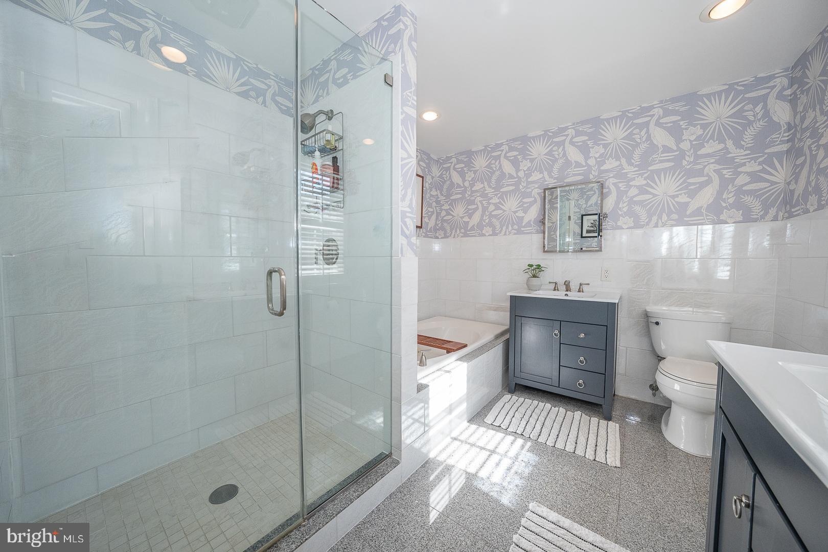 108 South Spring Mill Road Villanova, PA 19085 - Photo 23 of 53 a bathroom with a granite countertop bathtub sink mirror toilet and shower