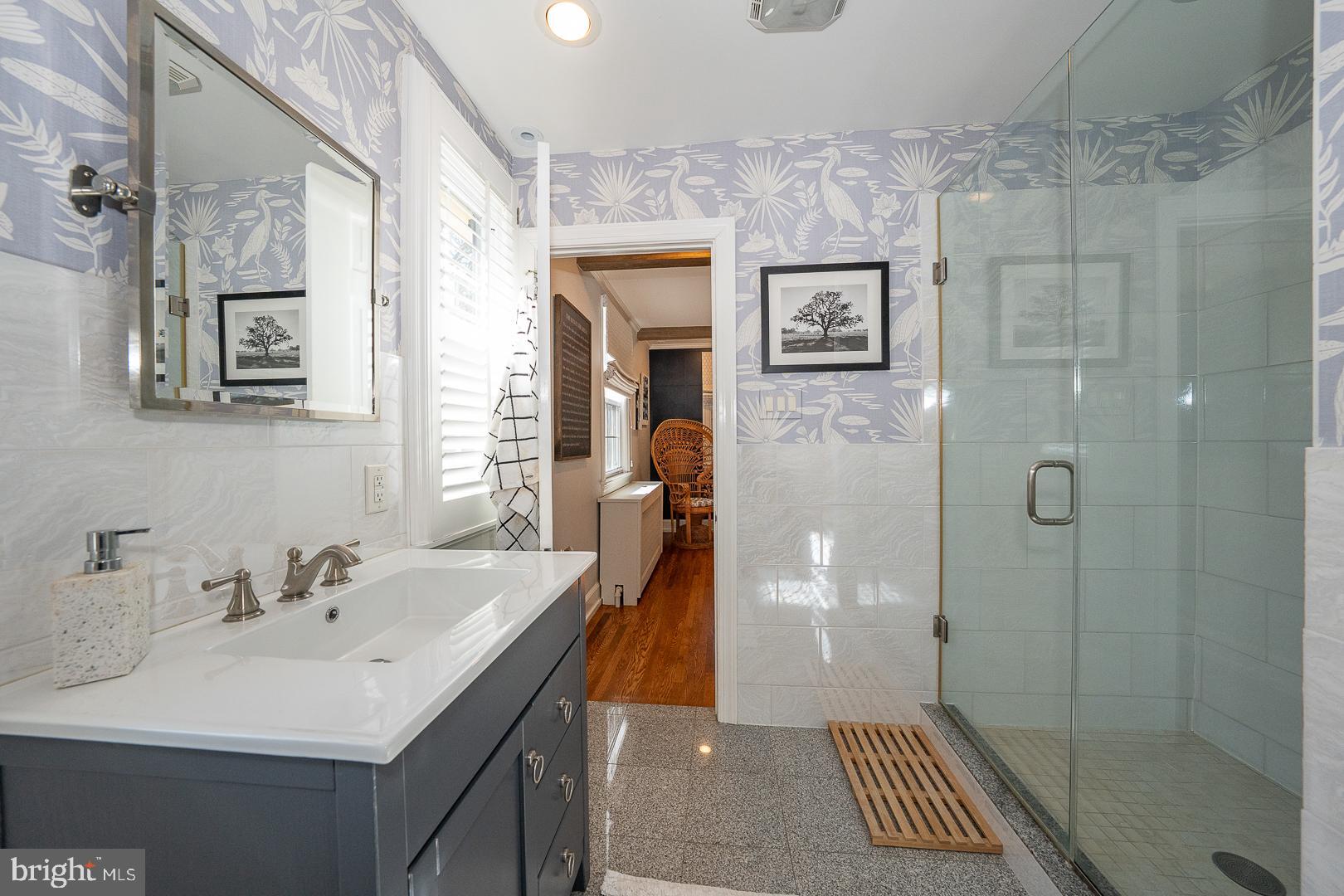 108 South Spring Mill Road Villanova, PA 19085 - Photo 24 of 53 a bathroom with a sink and a mirror