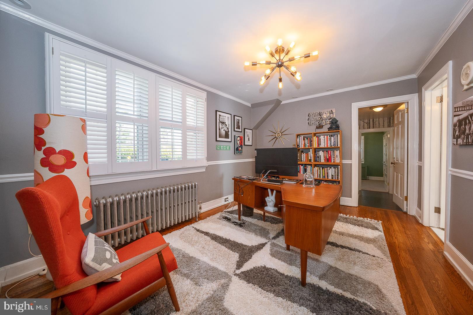 108 South Spring Mill Road Villanova, PA 19085 - Photo 26 of 53 a living room with furniture a rug and a chandelier