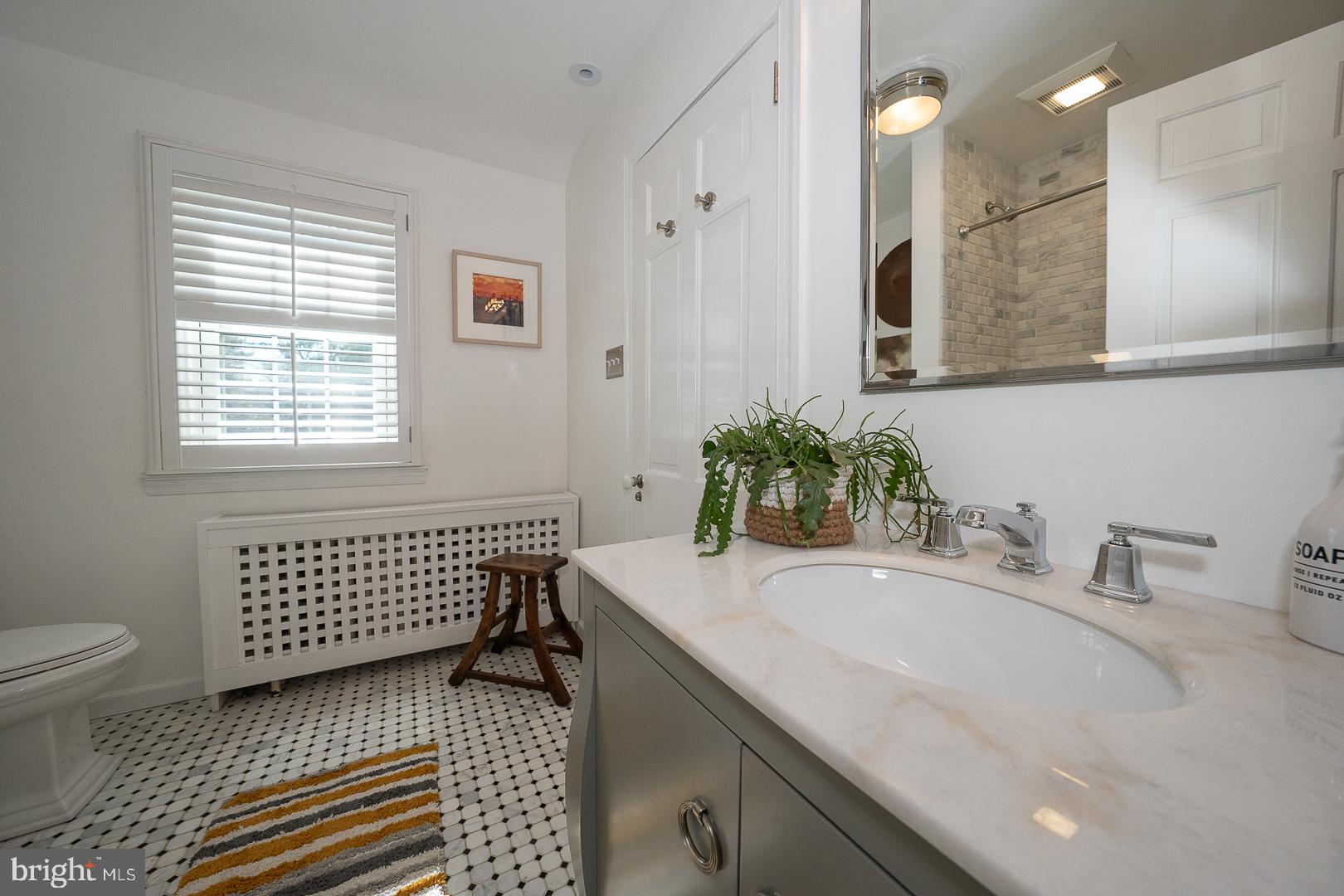 108 South Spring Mill Road Villanova, PA 19085 - Photo 29 of 53 a bathroom with a sink and a mirror
