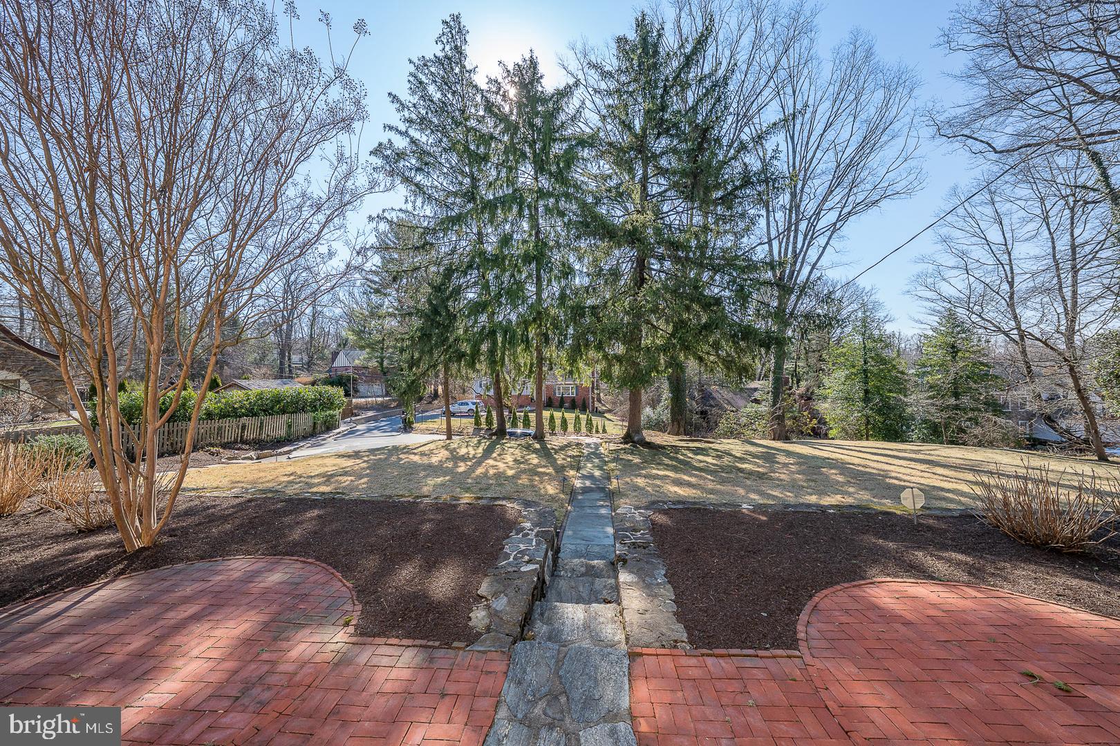108 South Spring Mill Road Villanova, PA 19085 - Photo 3 of 53 a view of a street with a large tree