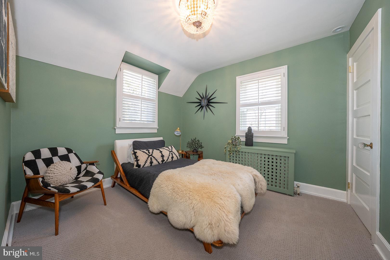 108 South Spring Mill Road Villanova, PA 19085 - Photo 31 of 53 a bedroom with a bed and a chair