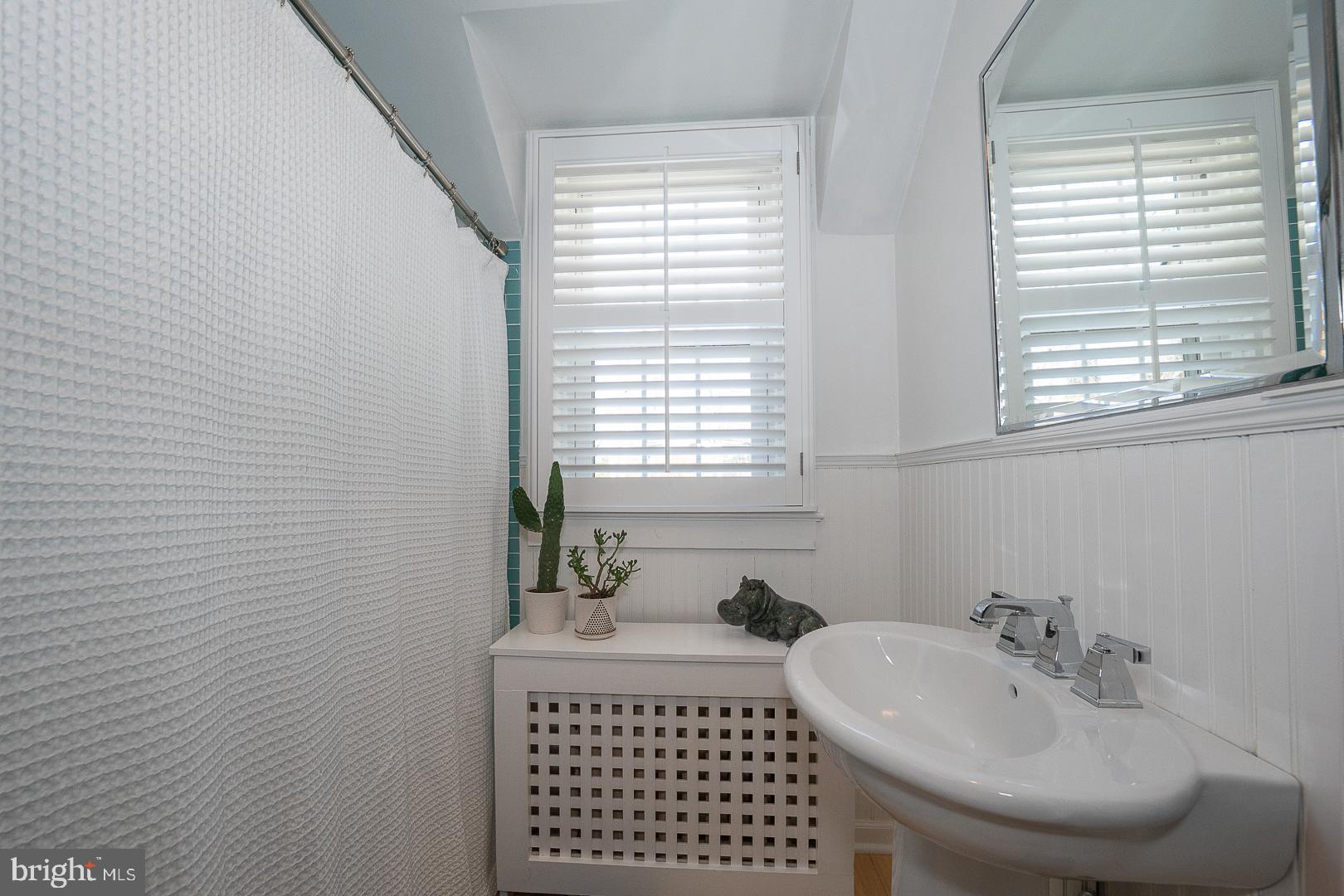 108 South Spring Mill Road Villanova, PA 19085 - Photo 32 of 53 a bathroom with a sink and a mirror
