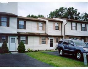 411 Rakov Road Maybrook, NY 12543 - Photo 1 of 1 a front view of a house with a garden
