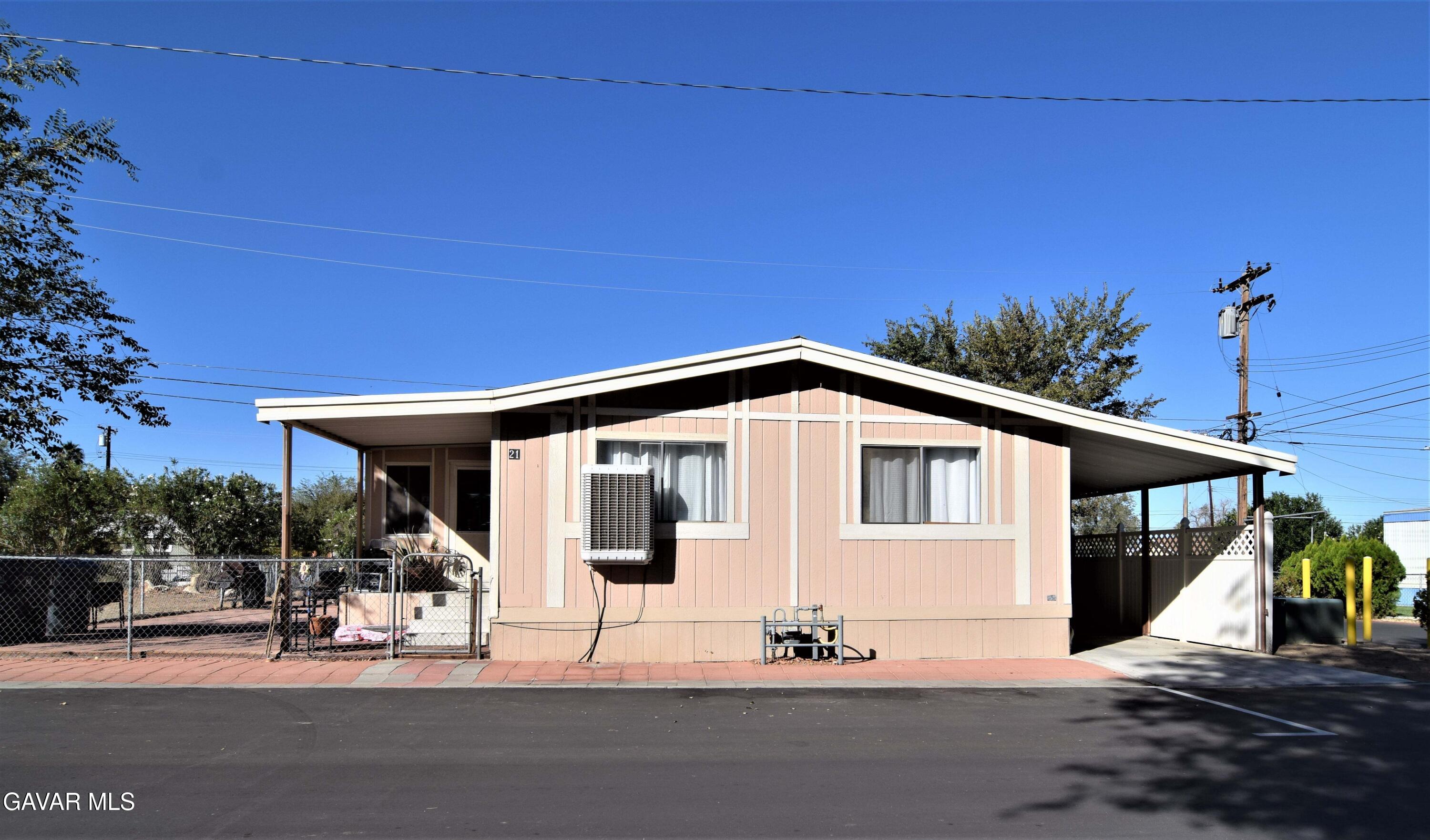 a front view of a house with a outdoor space