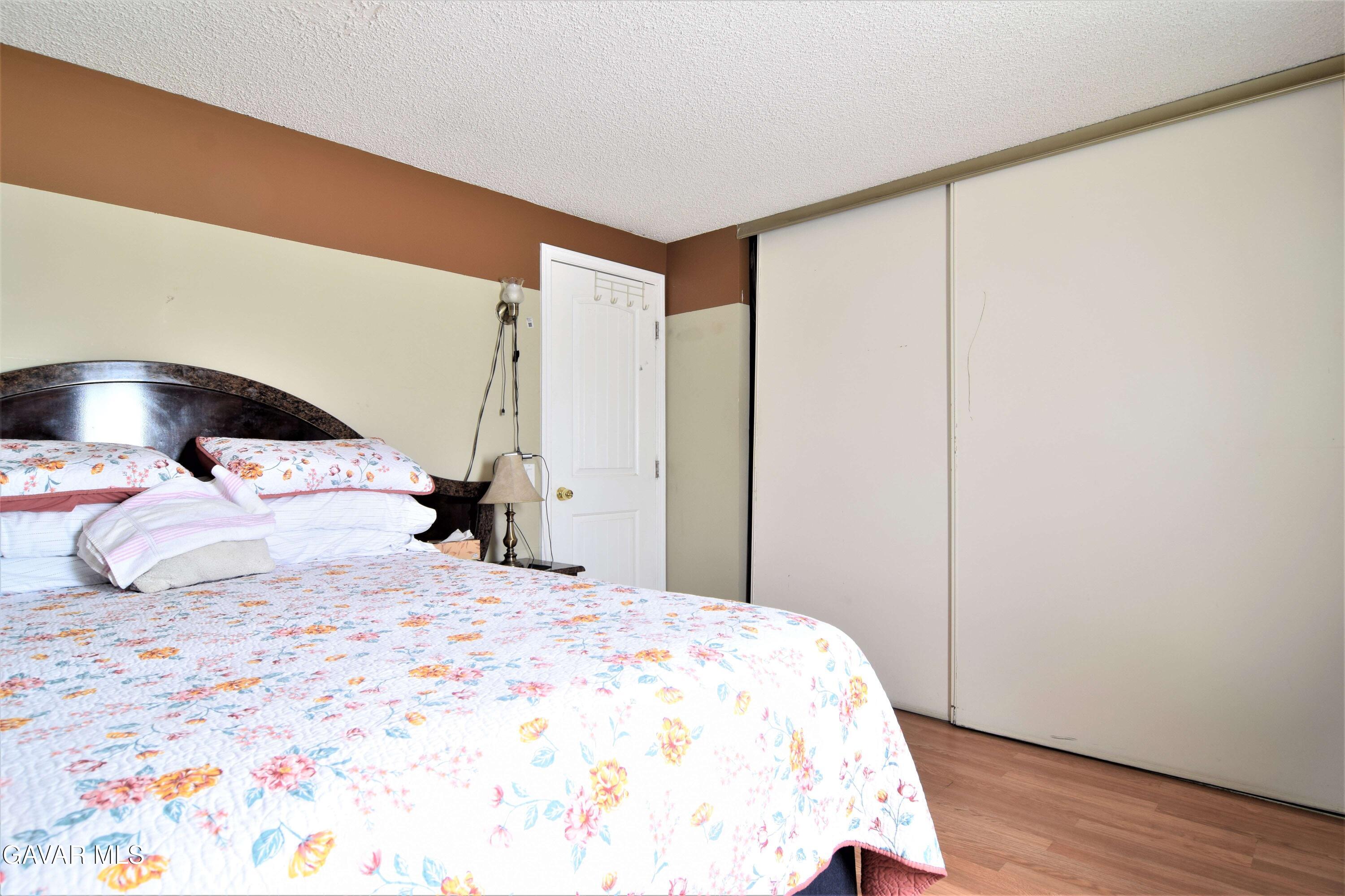 45446 7th Street East Lancaster, CA 93535 - Photo 16 of 21 a large white bed in a white room