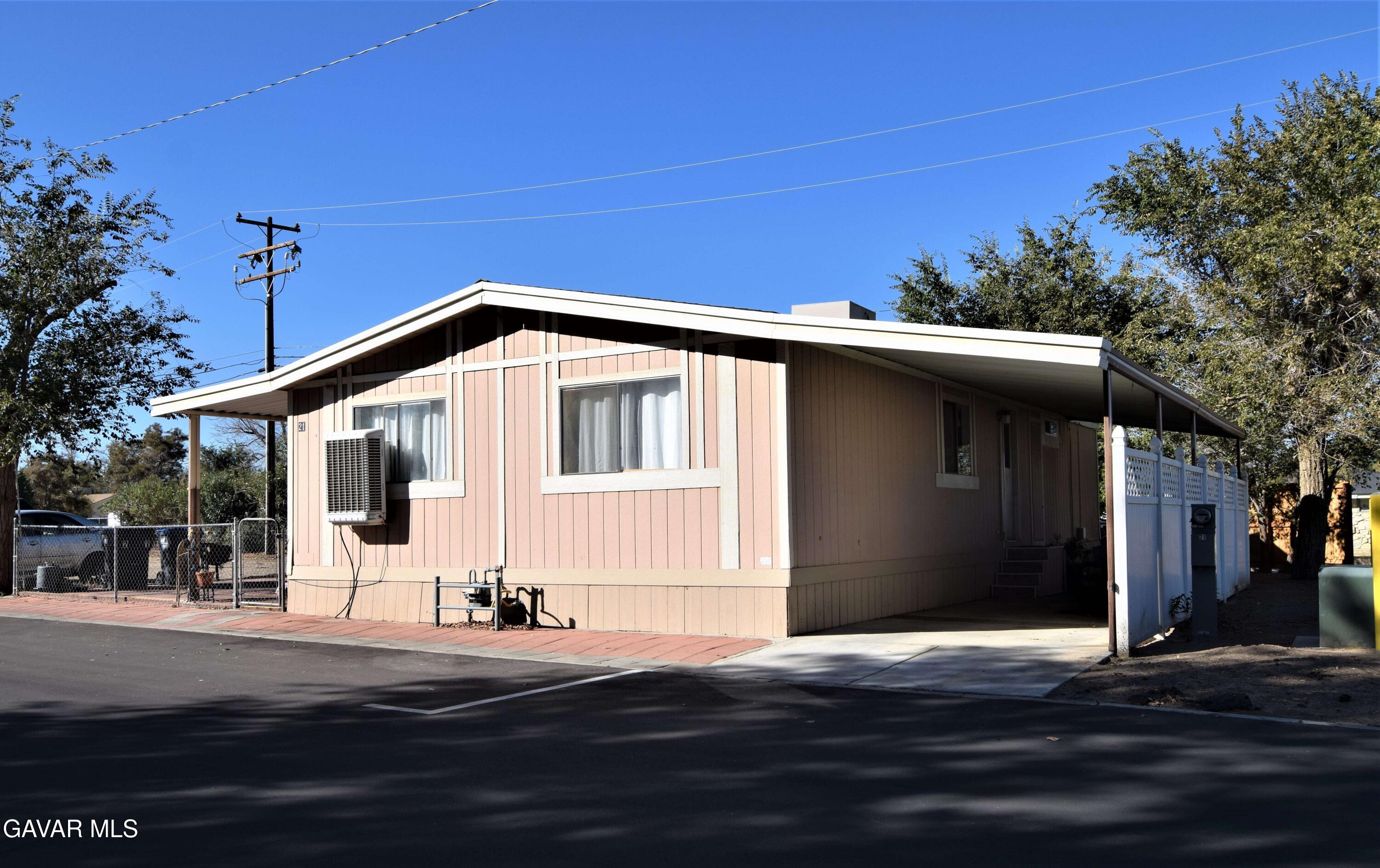 45446 7th Street East Lancaster, CA 93535 - Photo 2 of 21 a front view of a house with a yard