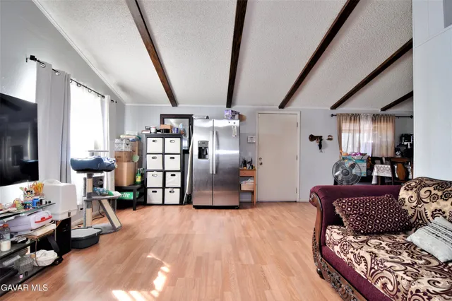 a bedroom with furniture and wooden floor