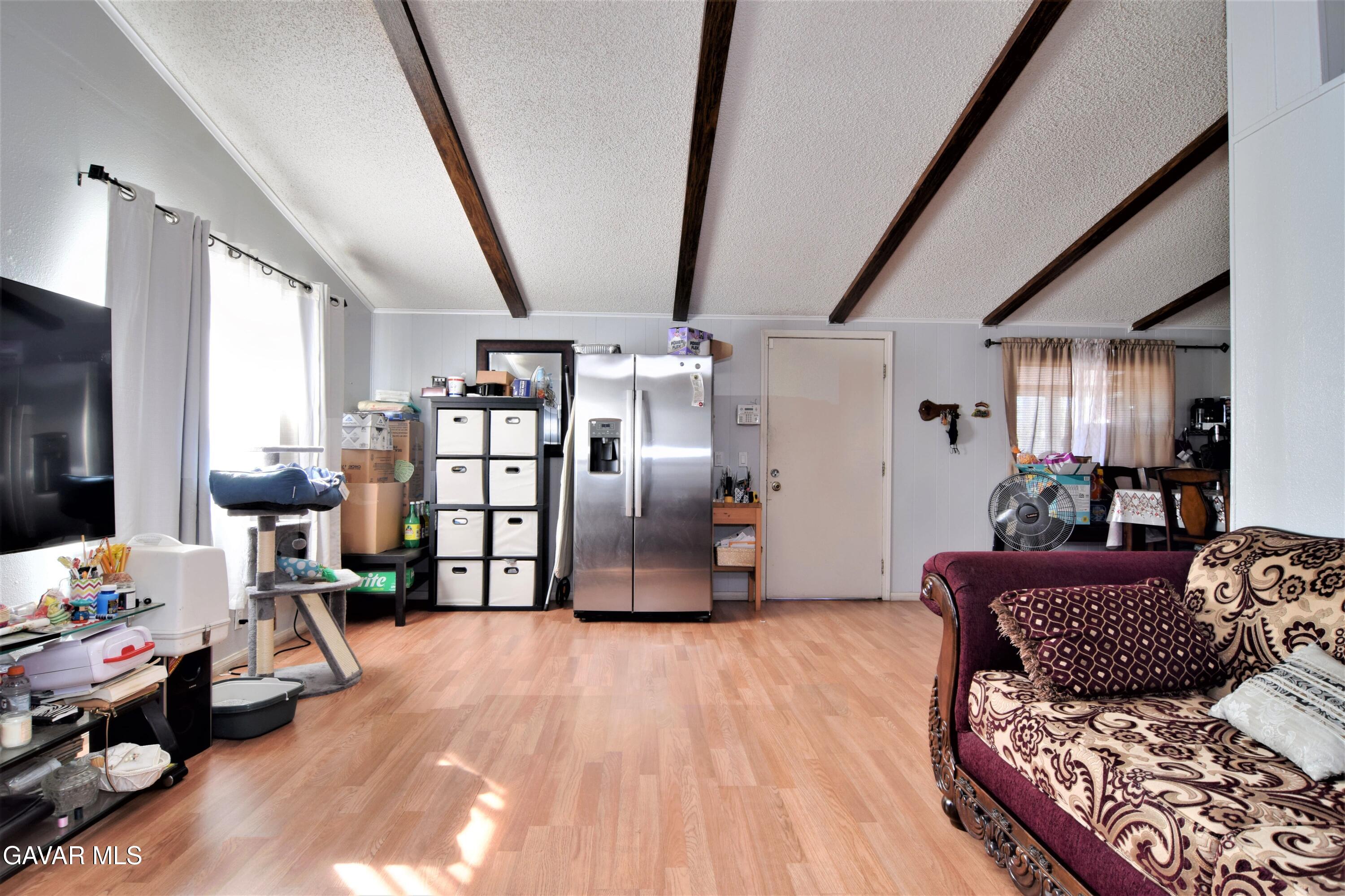 45446 7th Street East Lancaster, CA 93535 - Photo 6 of 21 a bedroom with furniture and wooden floor