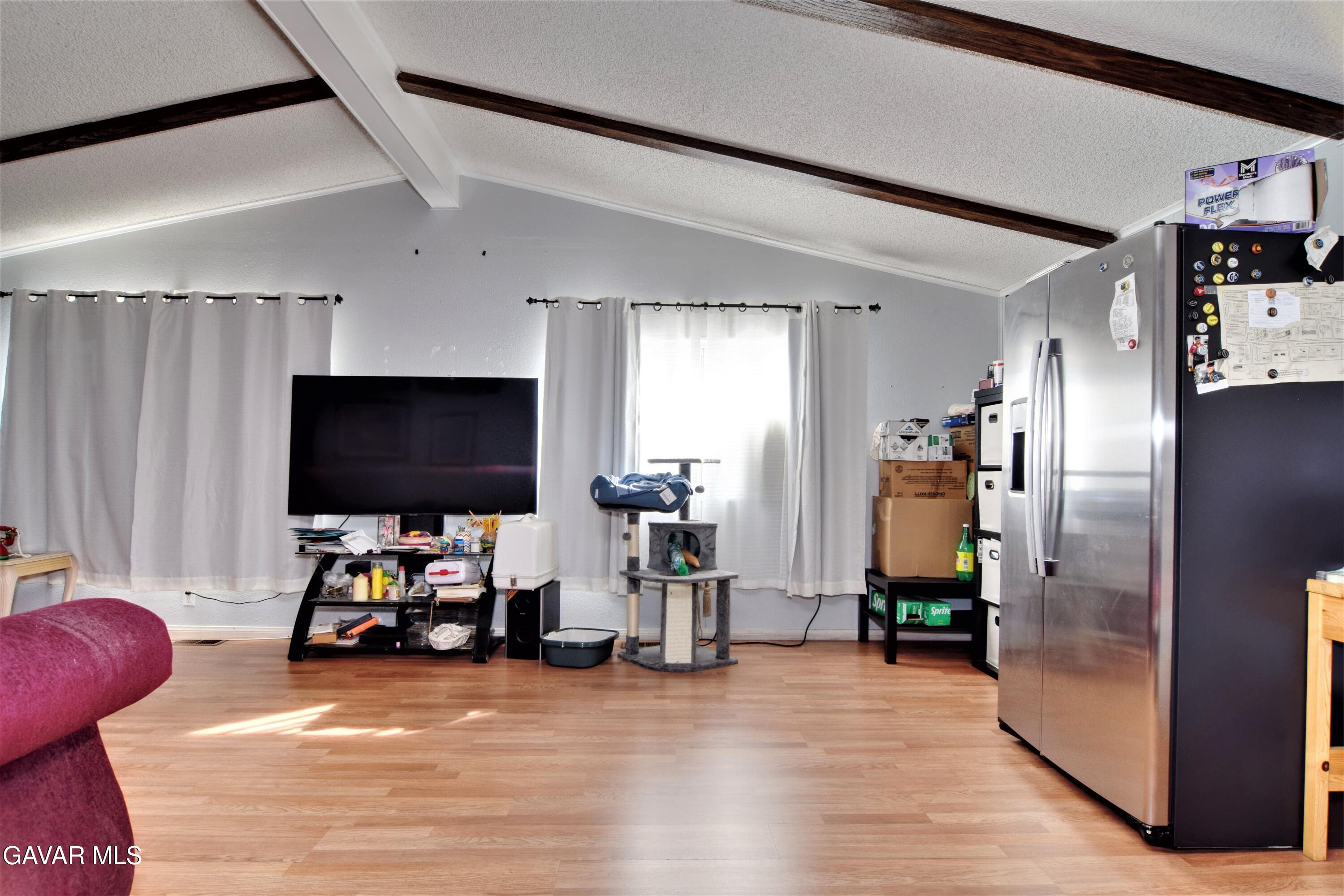 45446 7th Street East Lancaster, CA 93535 - Photo 7 of 21 a children room with furniture and a flat screen tv