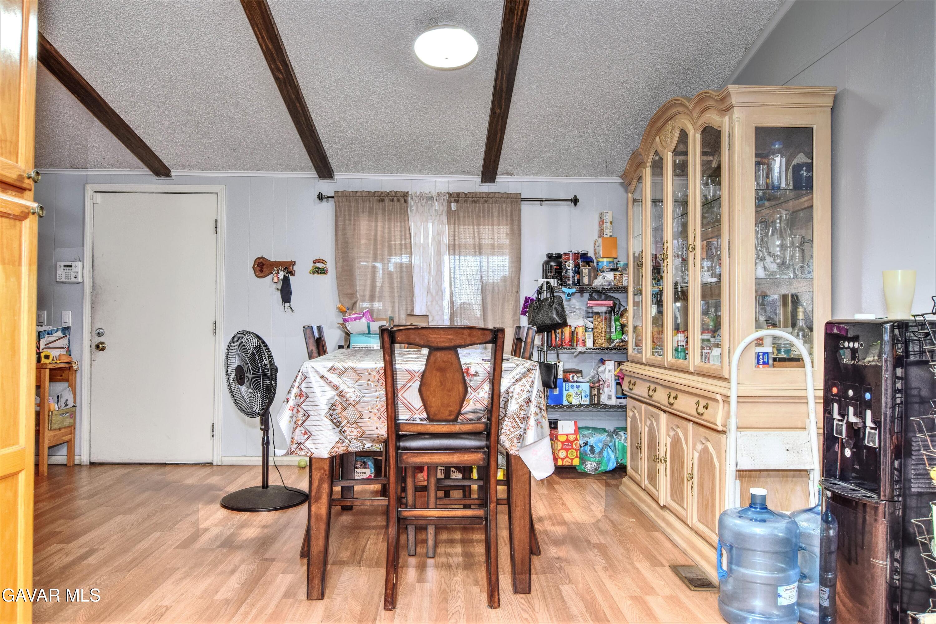 45446 7th Street East Lancaster, CA 93535 - Photo 9 of 21 a view of a dining room with furniture and a table