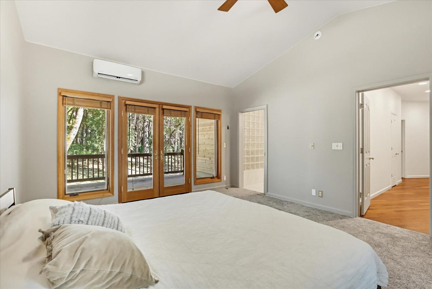 14517 North Bloomfield Road Nevada City, CA 95959 - Photo 26 of 78 a bedroom with a large bed and a large window