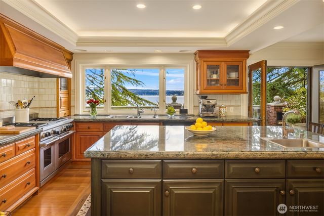 a kitchen with counter top space and center island