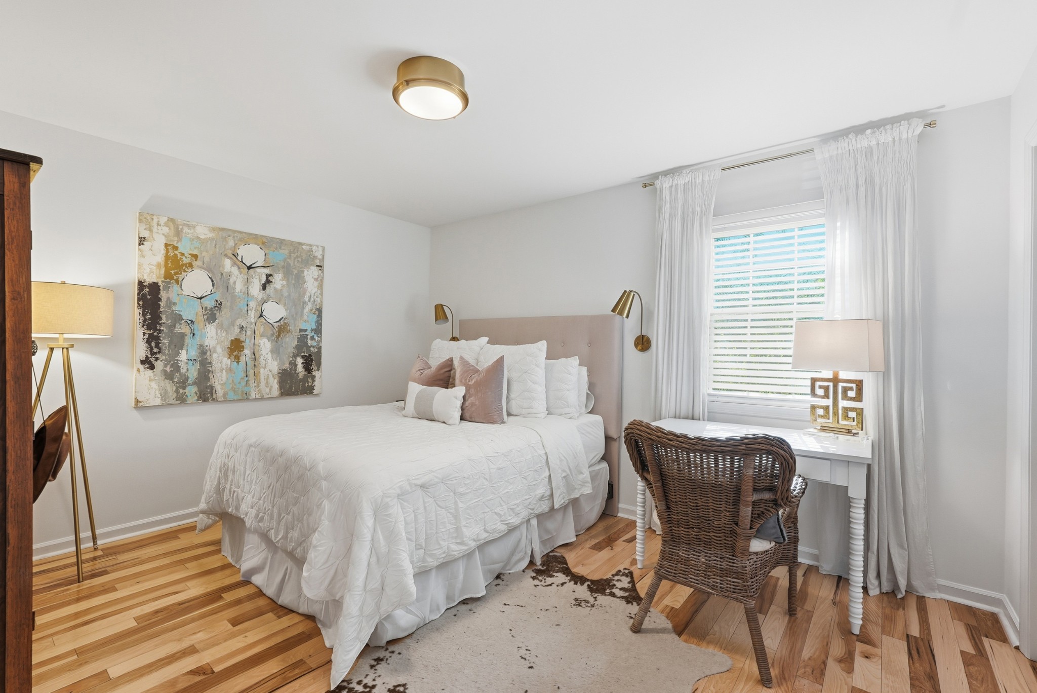 2821 Hazelwood Drive Nashville, TN 37212 - Photo 17 of 32 a bedroom with a bed and a chair