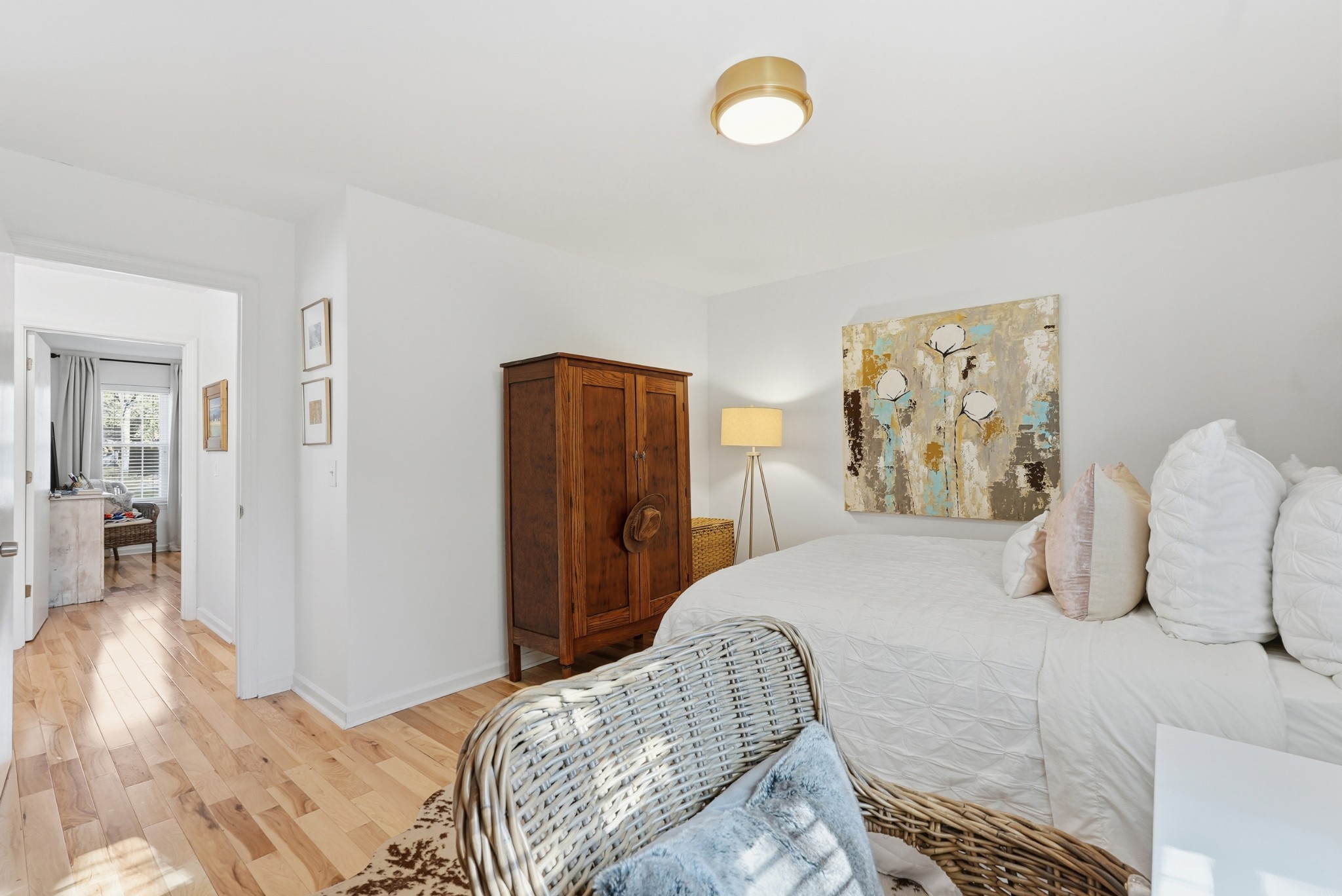 2821 Hazelwood Drive Nashville, TN 37212 - Photo 19 of 32 a bedroom with a bed and painting on the wall