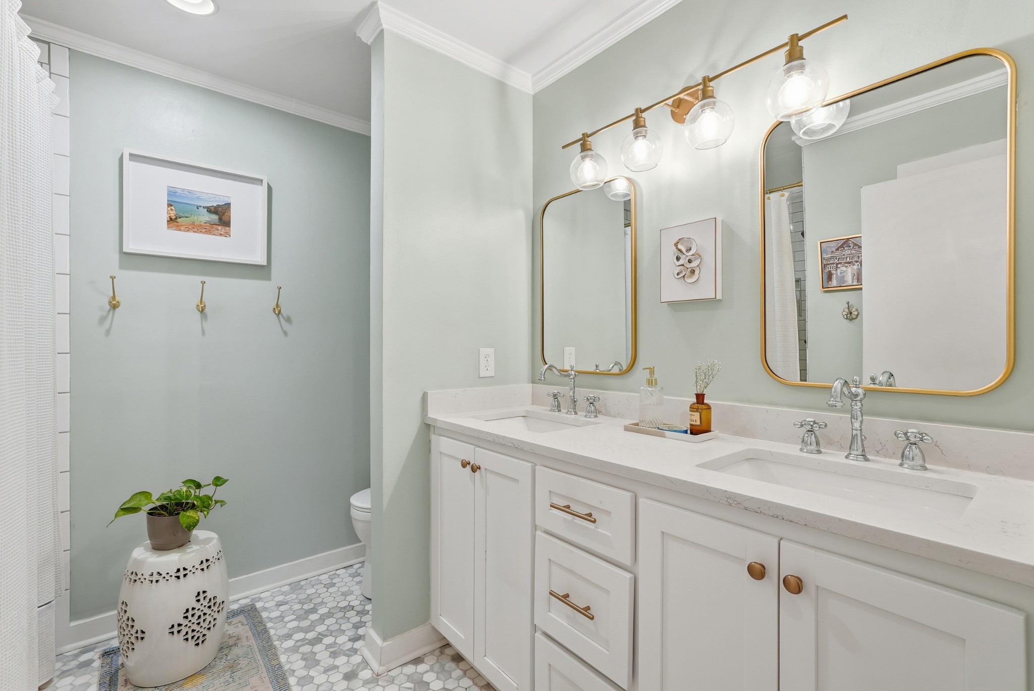 2821 Hazelwood Drive Nashville, TN 37212 - Photo 21 of 32 a bathroom with a double vanity sink and a mirror