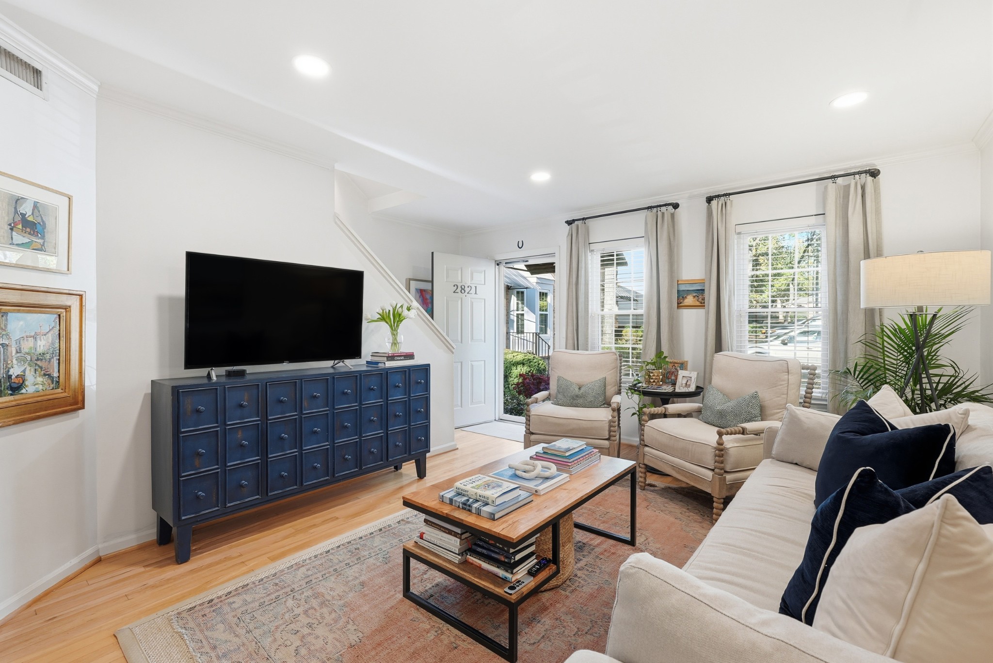 2821 Hazelwood Drive Nashville, TN 37212 - Photo 3 of 32 a living room with furniture and a flat screen tv