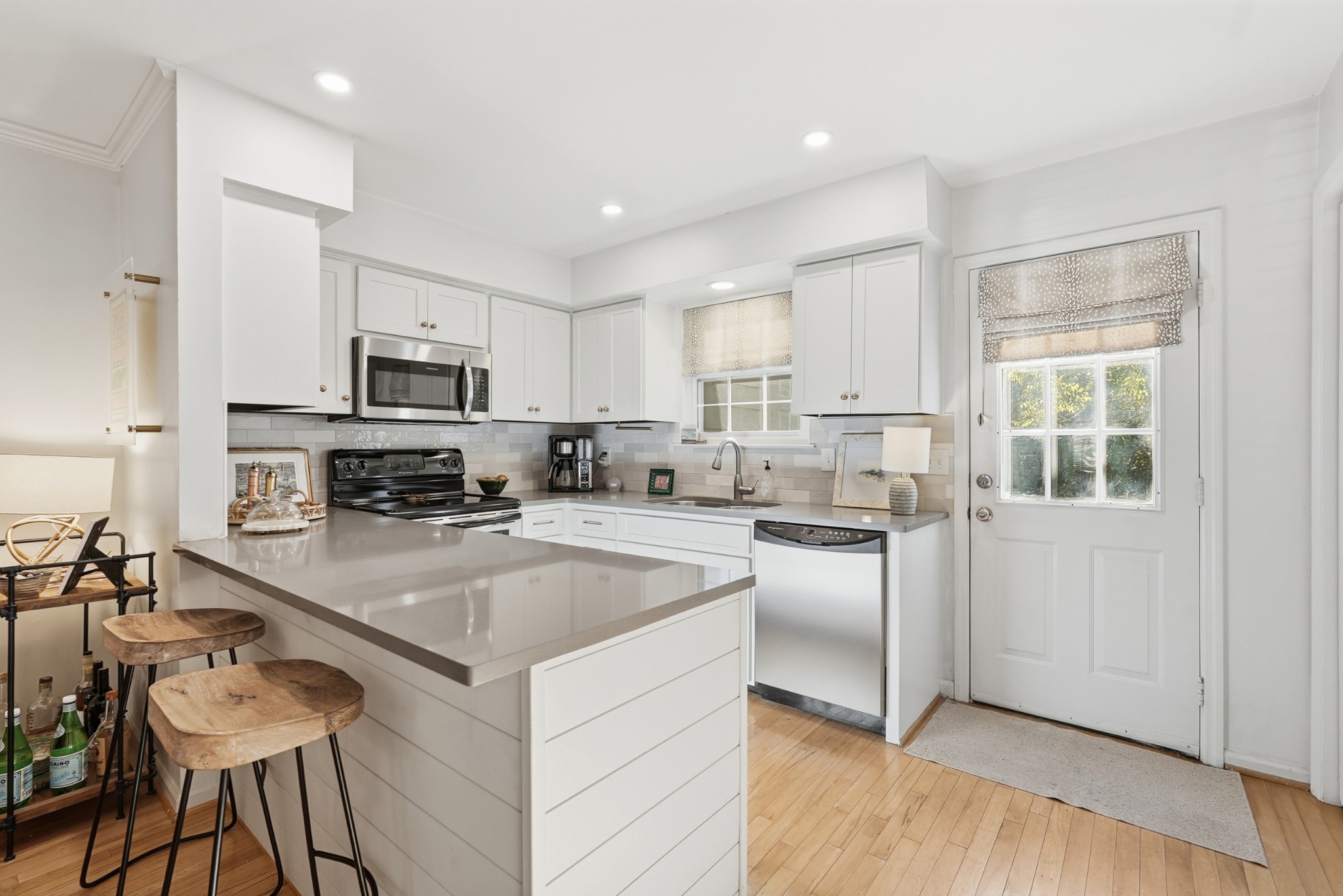 2821 Hazelwood Drive Nashville, TN 37212 - Photo 7 of 32 a kitchen with counter top space a sink cabinets and appliances