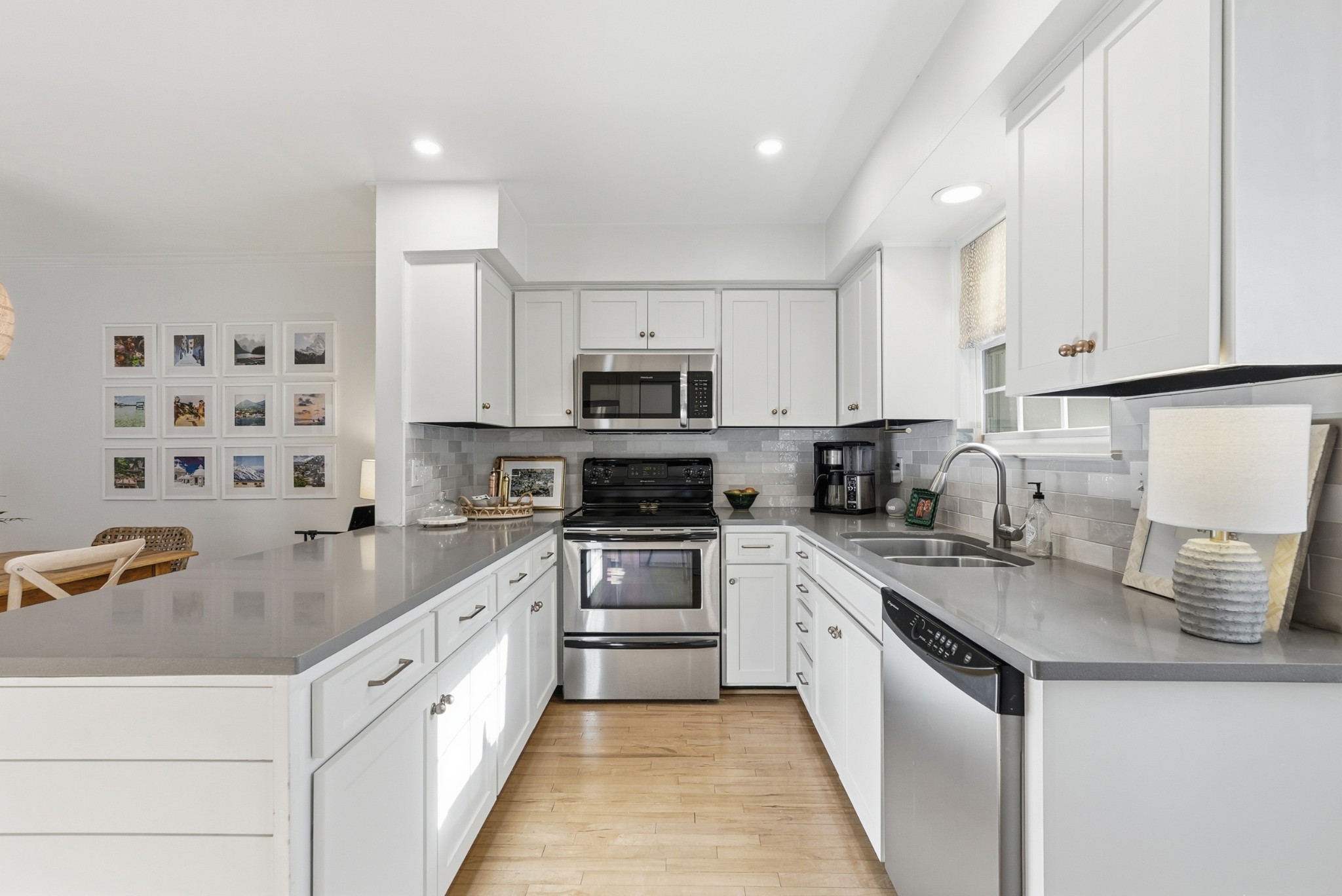 2821 Hazelwood Drive Nashville, TN 37212 - Photo 8 of 32 a kitchen with cabinets appliances a sink and a counter top space