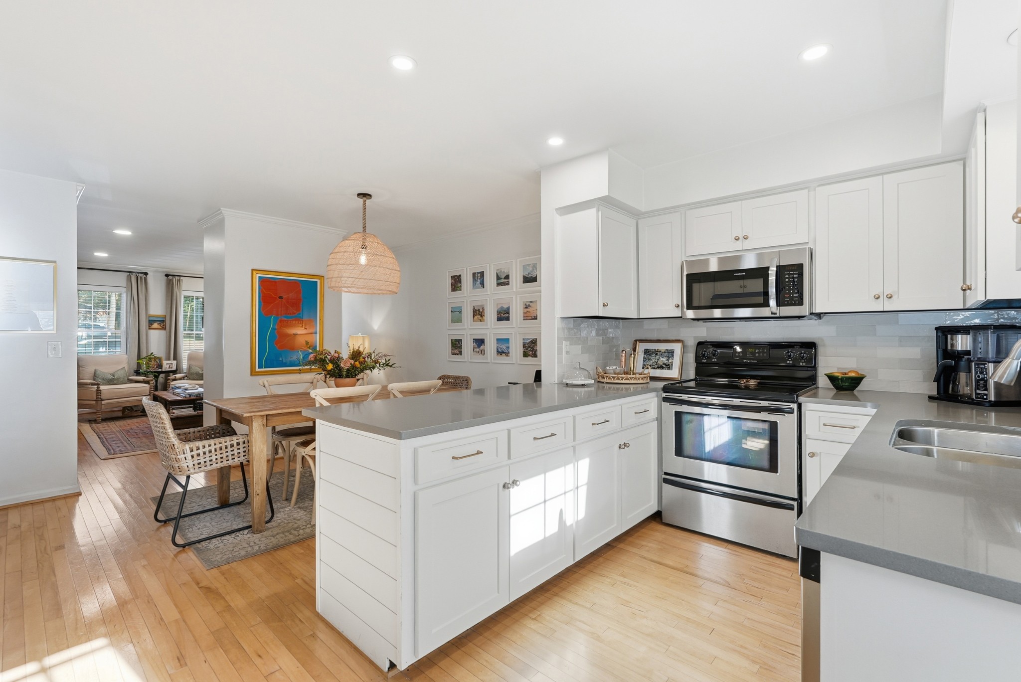 2821 Hazelwood Drive Nashville, TN 37212 - Photo 9 of 32 a kitchen with white cabinets and stainless steel appliances