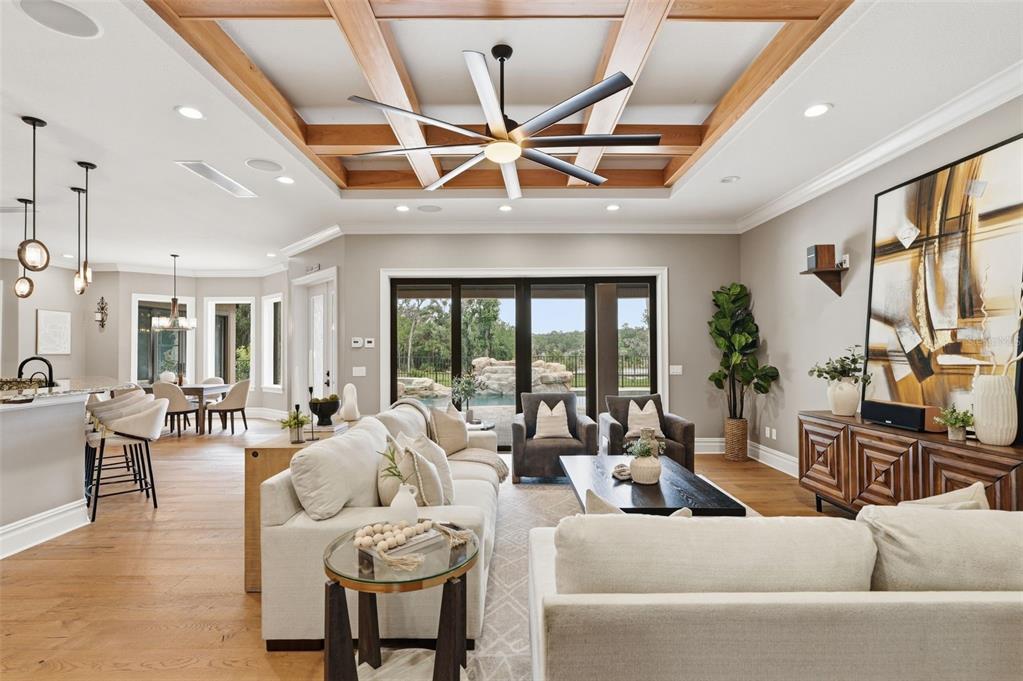 855 Southeast 87th Street Ocala, FL 34480 - Photo 11 of 79 a living room with furniture a ceiling fan and a large window