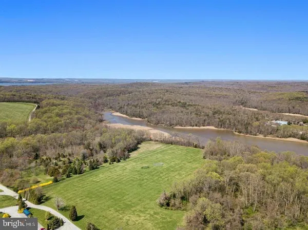 a view of a lake with a yard